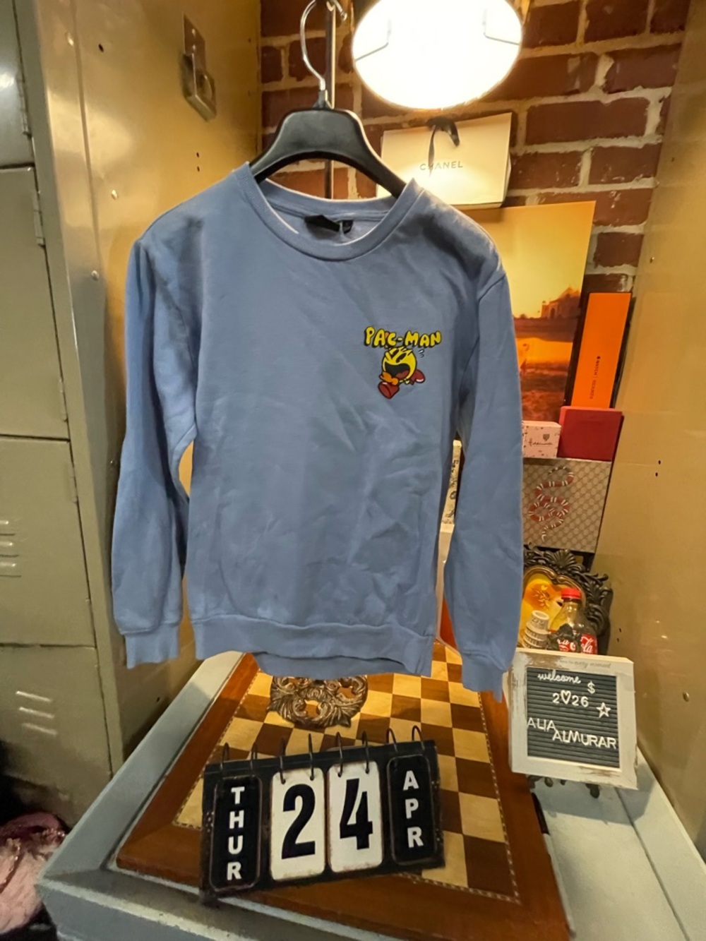 Pac-Man graphic sweatshirt featuring the iconic video game character a ghost.